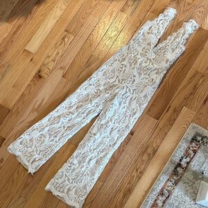 Lulu’s Lace V-Neck Sleeveless Jumpsuit in Ivory